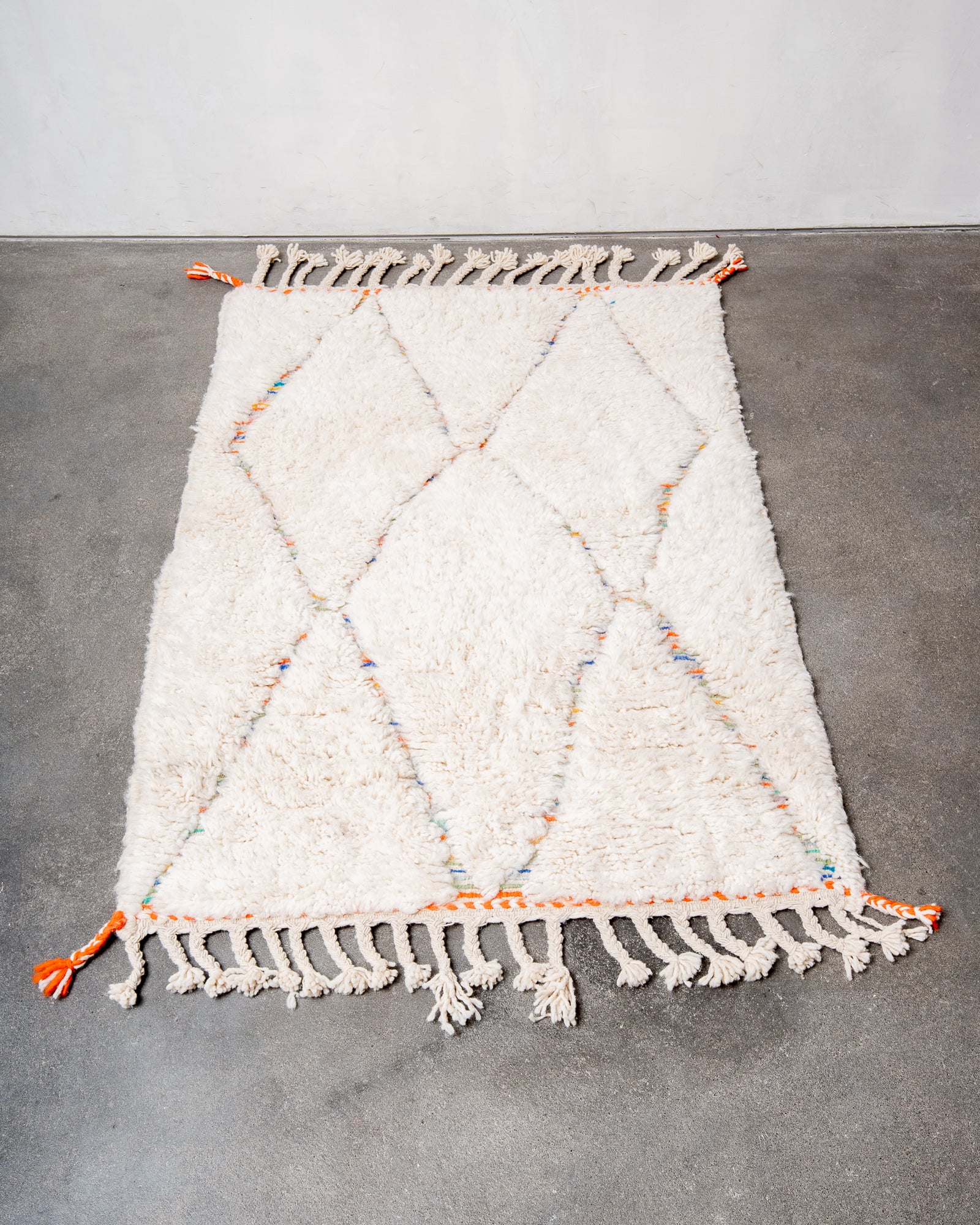 Modern, designer, handcrafted Berber rug from Morocco. Beniourain carpet with beautiful colours and patterns and fluffy wool texture.